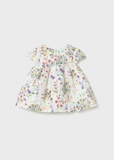 Abito elegante Scugnizzi 0-16 per bambina con stampa floreale pastello, maniche a volant e linea svasata.