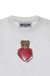 Abito bianco in cotone Scugnizzi 0-16 con stampa Teddy Bear Moschino che abbraccia un cuore rosso sul petto