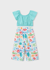 Completo estivo Scugnizzi 0-16 per bambina con top verde acqua a volant e pantaloni a stampa marina colorata