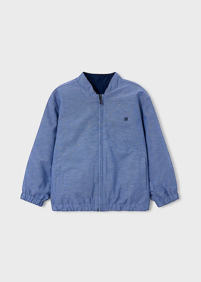 Giacca bomber reversibile blu Scugnizzi 0-16 con chiusura a zip, polsini elasticizzati e design versatile per bambini.