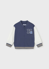 Scugnizzi 0-16 giacca varsity blu navy e bianca per ragazzo con applique di ippopotamo e lettera H. Finiture a coste.