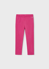 Leggings lunghi fucsia Scugnizzi 0-16 in tessuto elasticizzato con logo ricamato sul fianco per bambina.