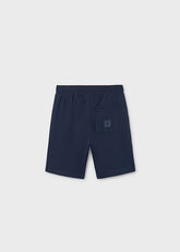 Pantaloncini sportivi blu navy Scugnizzi 0-16 per bambino con tasca posteriore e logo, vista posteriore.