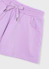 Pantaloncini sportivi Scugnizzi 0-16 lilla in cotone con vita elasticizzata, cordoncino e tasche con bordo decorato.