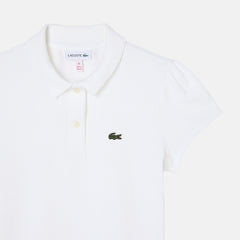 Polo bianca Lacoste per bambina in piqué di cotone con colletto smerlato, maniche arricciate e logo coccodrillo