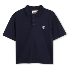 Polo blu a maniche corte Timberland per bambini con logo ricamato sul petto, disponibile da Scugnizzi 0-16