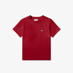 T-shirt rossa a maniche corte in cotone Lacoste con logo coccodrillo ricamato, proposta da Scugnizzi 0-16