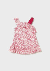 Scugnizzi 0-16 abito estivo asimmetrico bianco con stampa stelle rosa, fiocco e balze.