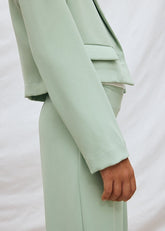 Scugnizzi 0-16 completo giacca corta color menta e pantaloni larghi a vita alta, tessuto leggero, tasche applicate.