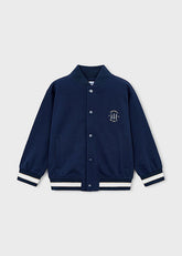 Giacca bomber Scugnizzi 0-16 blu navy in cotone per bambino, con colletto alla coreana, chiusura a bottoni e ricamo ispirato al football.