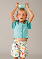 Scugnizzi 0-16 shorts da bambina con stampa tropicale di soli, stelle marine e palme. Vita elasticizzata con laccetto.