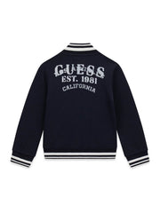 Giacca varsity Scugnizzi 0-16 blu navy con logo GUESS EST. 1981 CALIFORNIA ricamato sul retro e bordi a righe bianche.