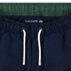 Dettaglio vita elasticizzata con coulisse bianca di pantaloncini sportivi blu navy Scugnizzi 0-16 Lacoste