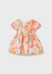 Abito estivo Scugnizzi 0-16 con stampa floreale arancione, rosa e lilla, maniche a sbuffo e fiocco decorativo.